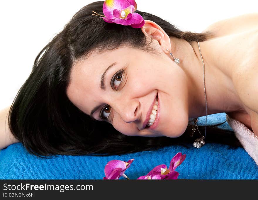 Beautiful woman with flower in her hairs at spa. Beautiful woman with flower in her hairs at spa