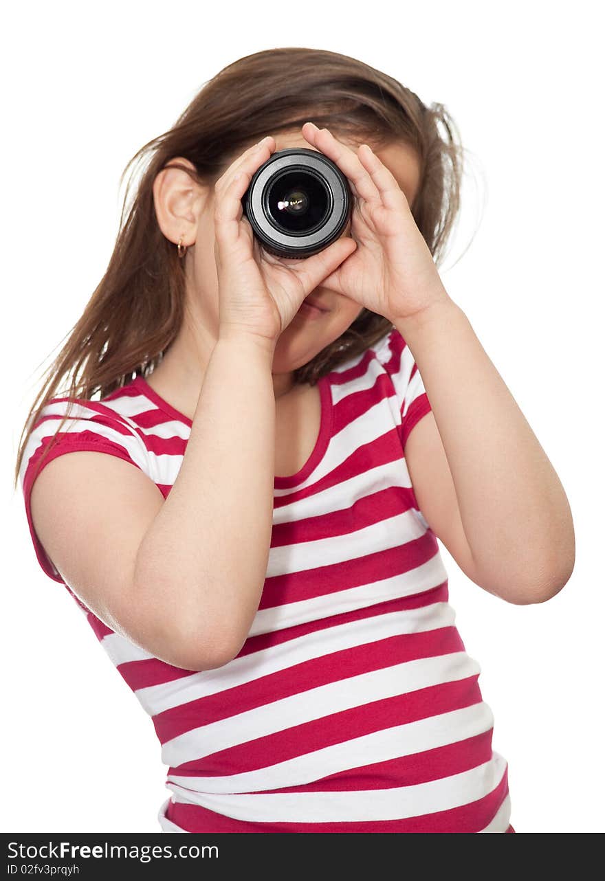 Young girl looking through a camera lens on a white background