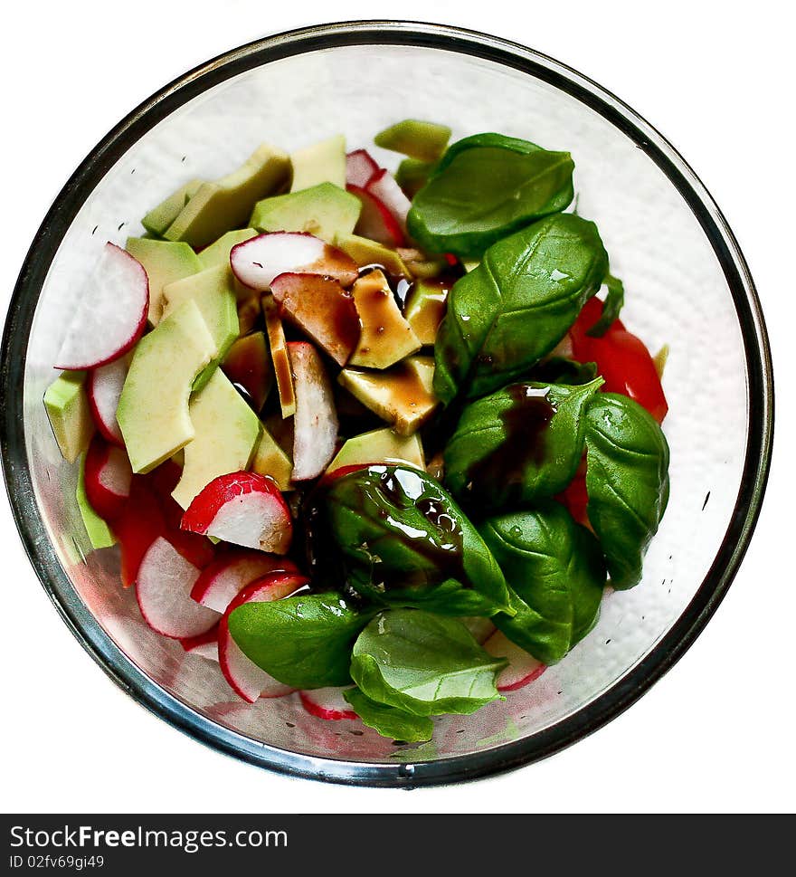 Vegetables salad in the glass bowl on  white background. Vegetables salad in the glass bowl on  white background