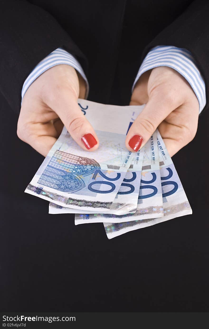 Young businesswoman holding euro notes