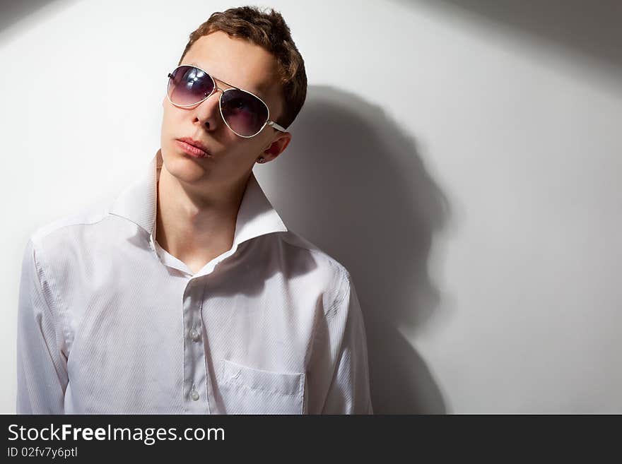 Portrait of young handsome man in sunglasses