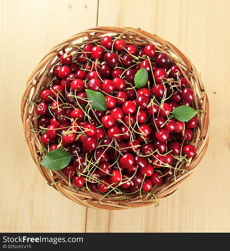 Freshly picked red cherries in a basket. Freshly picked red cherries in a basket