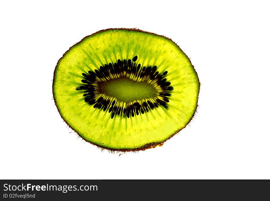 Close up of kiwi fruit slice on white background