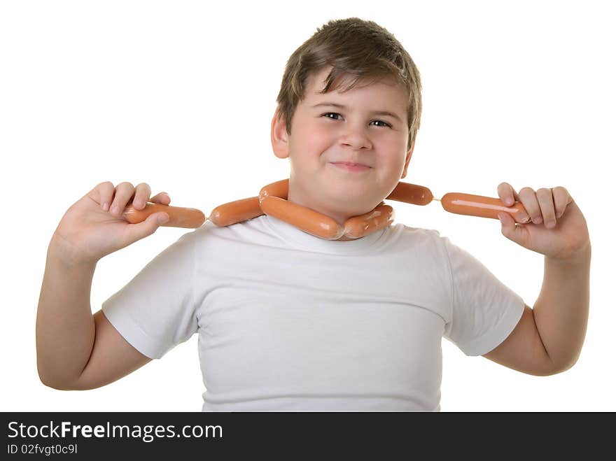 Happy boy has wrapped up sausages round neck isolated in white