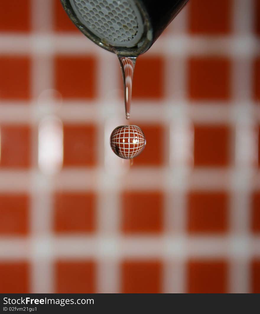 Water drop with the background reflected inside. Water drop with the background reflected inside.