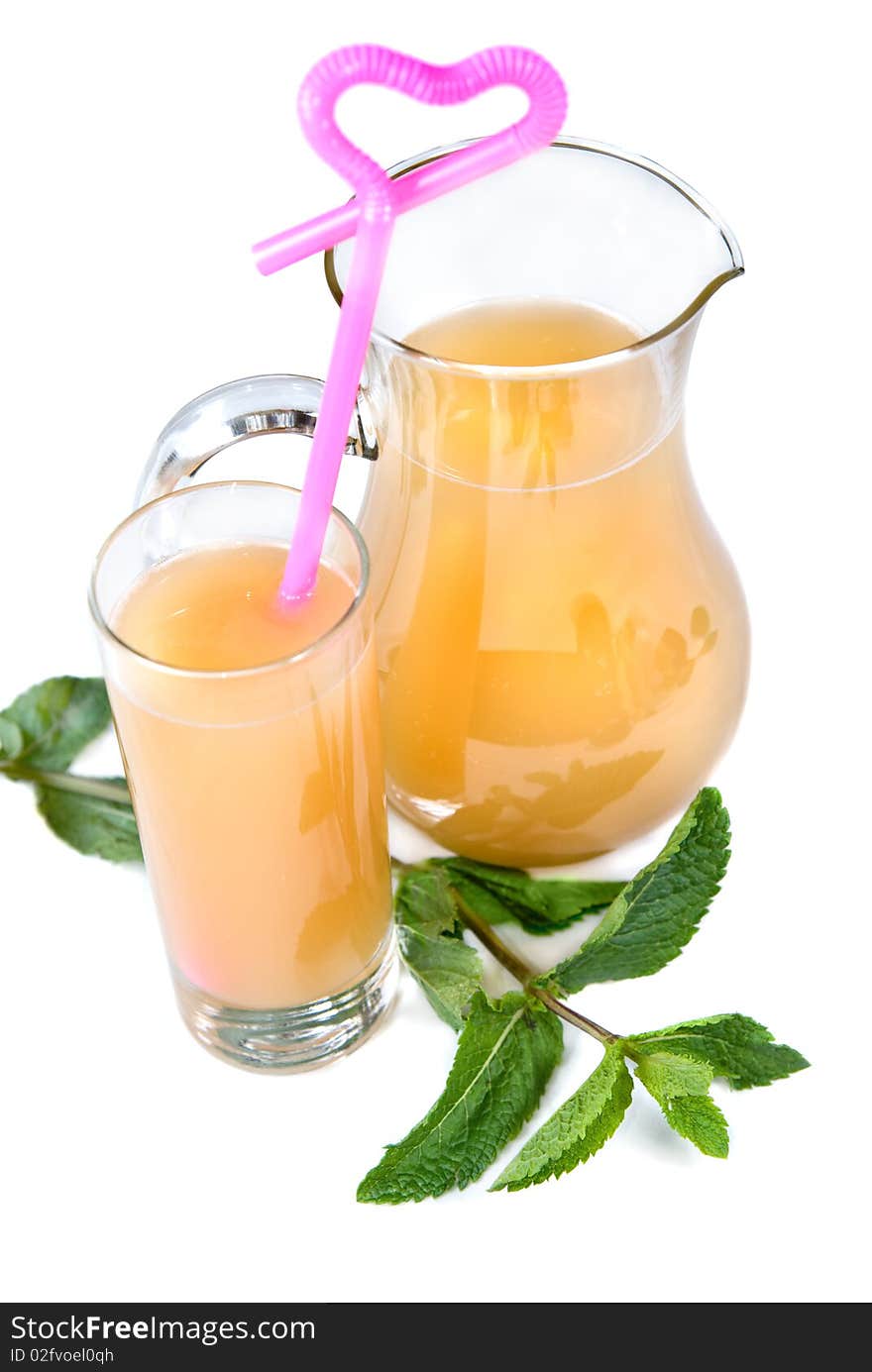 Cold drink in glass with mint isolated on white