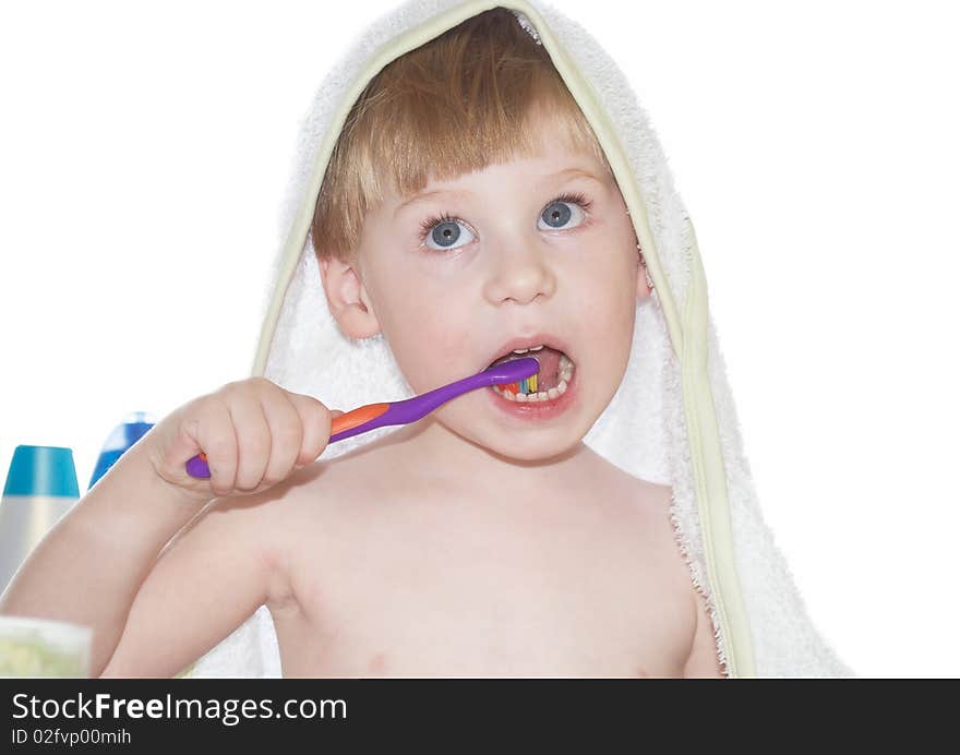 The little boy cleans a teeth on a white background. The little boy cleans a teeth on a white background