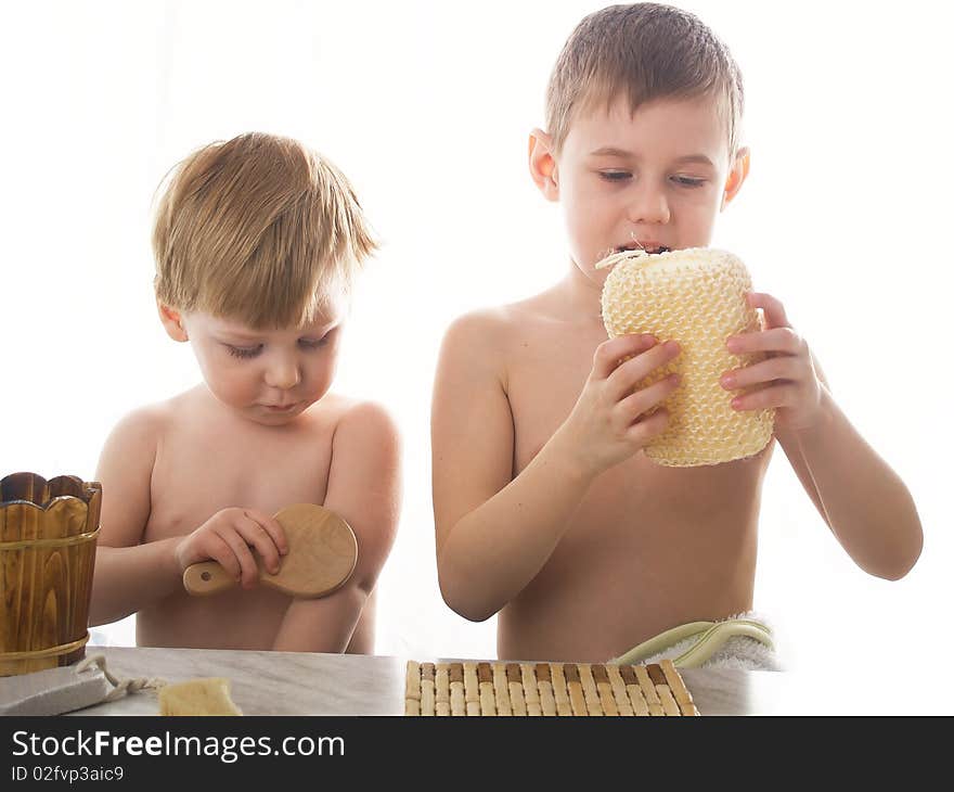 Two beautiful boys wash on white background. Two beautiful boys wash on white background