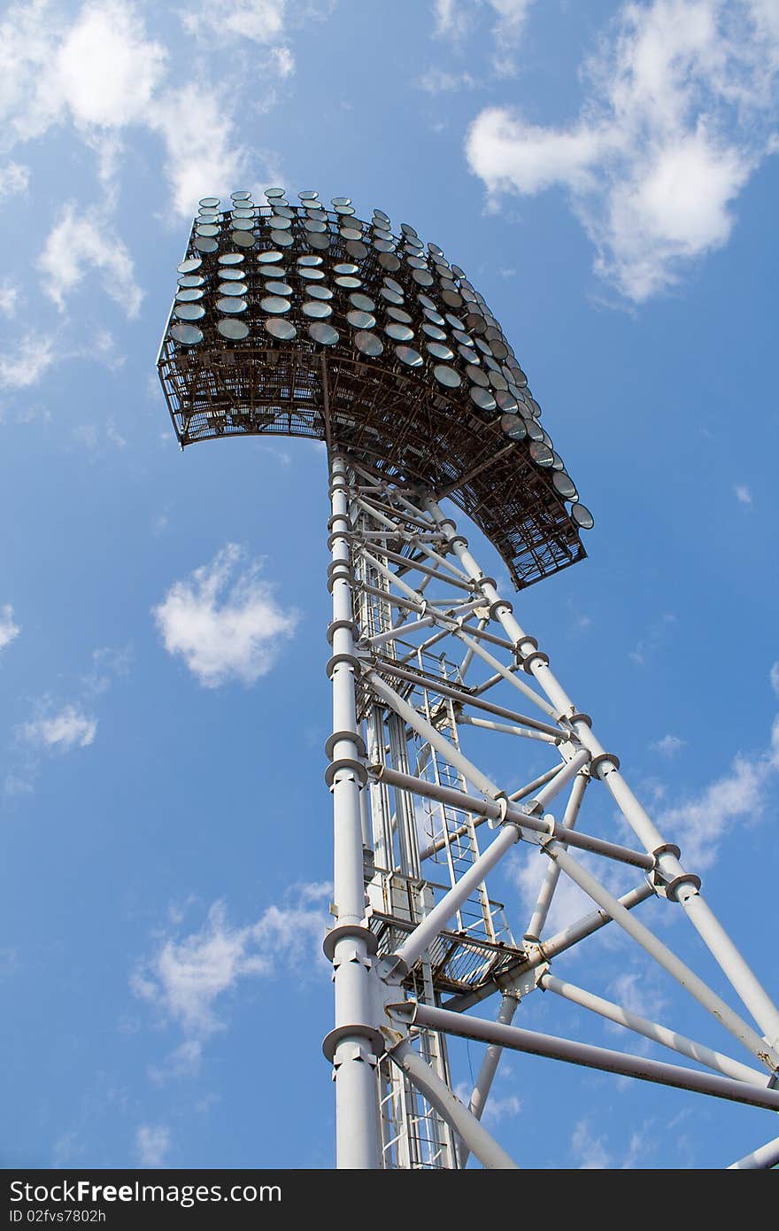 Stadium light tower against a blue sky