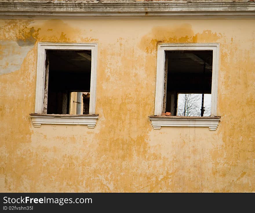 The wall of old building with windows