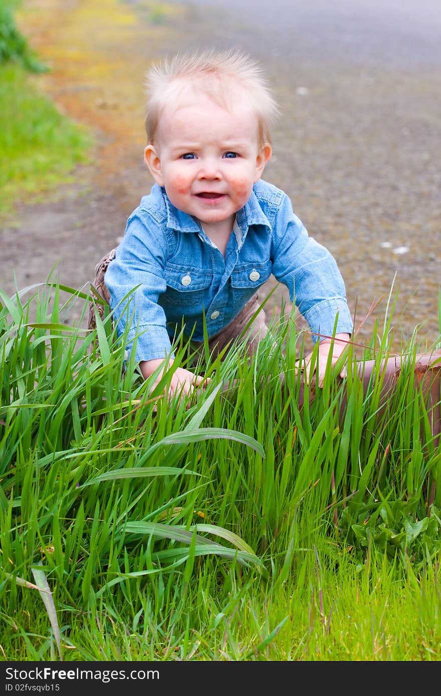 A young boy poses for a portrait with vibrant color and unique personality. A young boy poses for a portrait with vibrant color and unique personality.