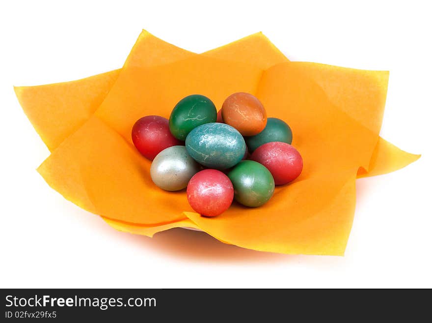 Easter dyed egg for orange napkin on white background