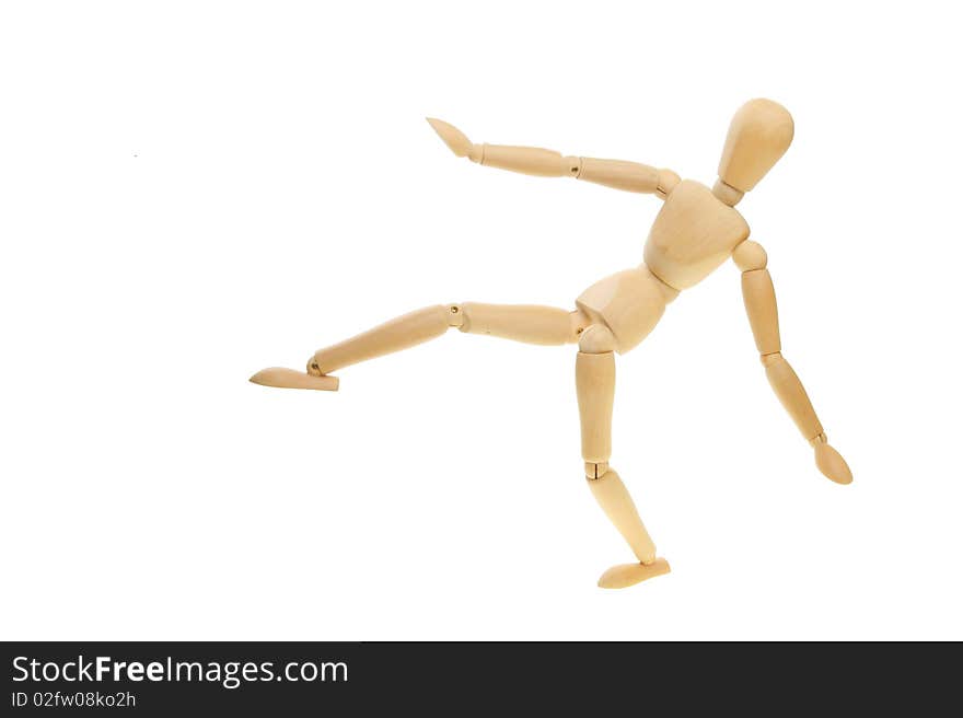 Artist's mannequin in a martial art kicking pose. Artist's mannequin in a martial art kicking pose