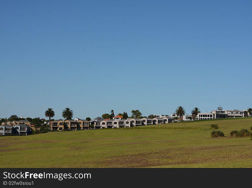 Row of houses fronting park land