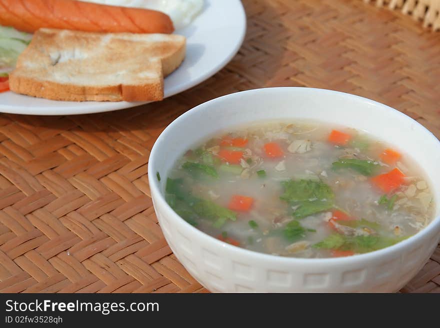 Delicious Soup in a cup with in bread background. Delicious Soup in a cup with in bread background.