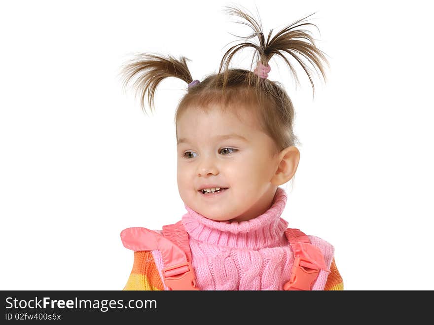 The little girl smiles on a white background