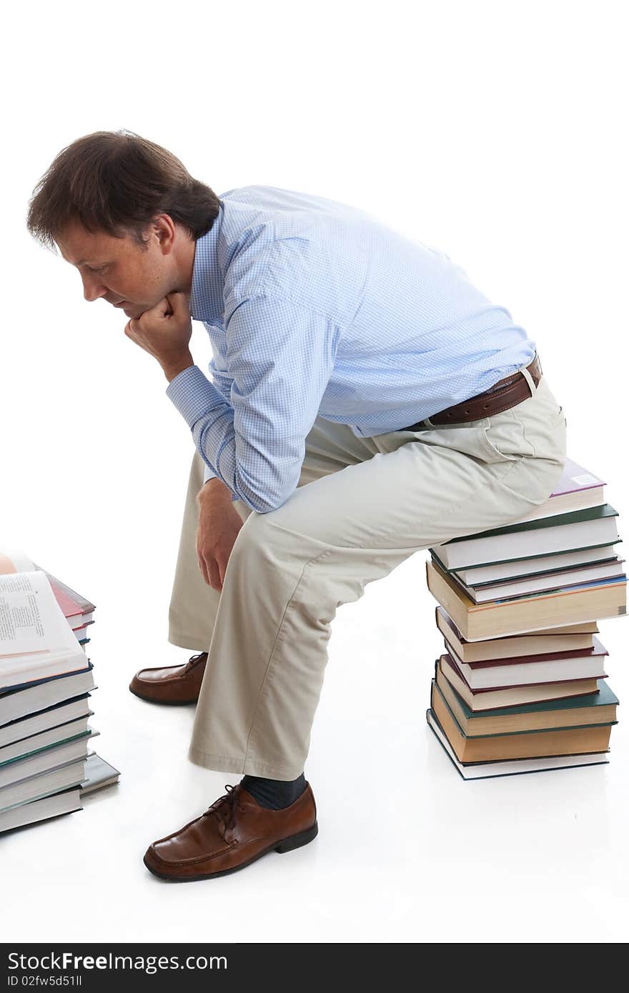 The young student with books isolated on a white