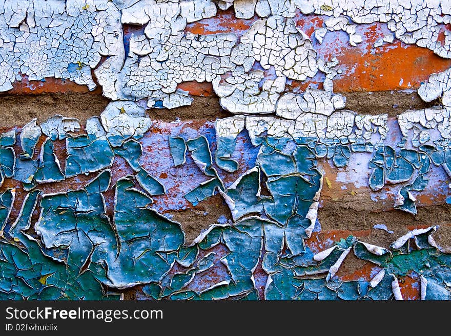 Texture - old dirty wall covered with peeling paint