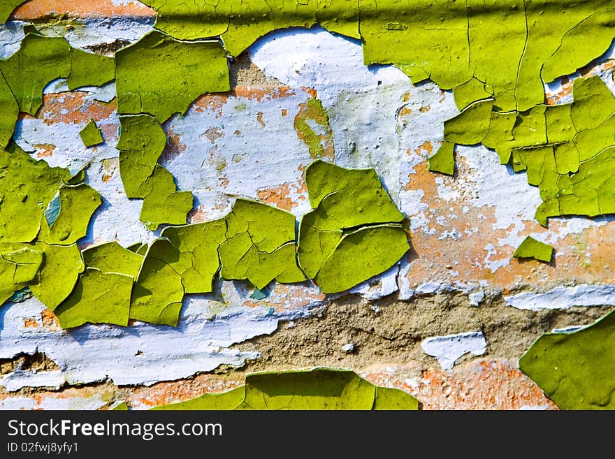 Texture - old dirty wall covered with peeling paint