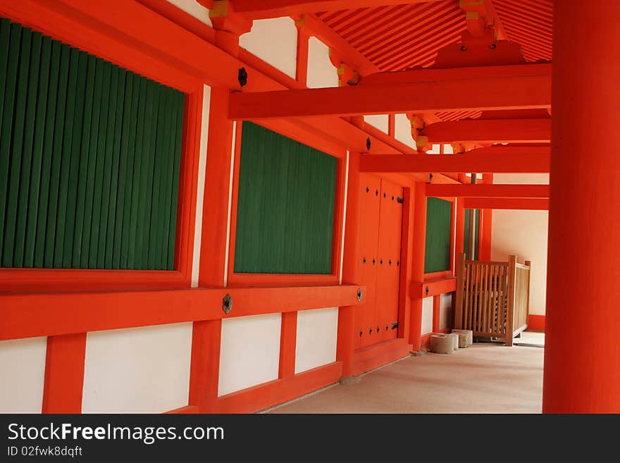 Red, white and green covered walk way at a traditional Japanese Shinto Temple. Red, white and green covered walk way at a traditional Japanese Shinto Temple.