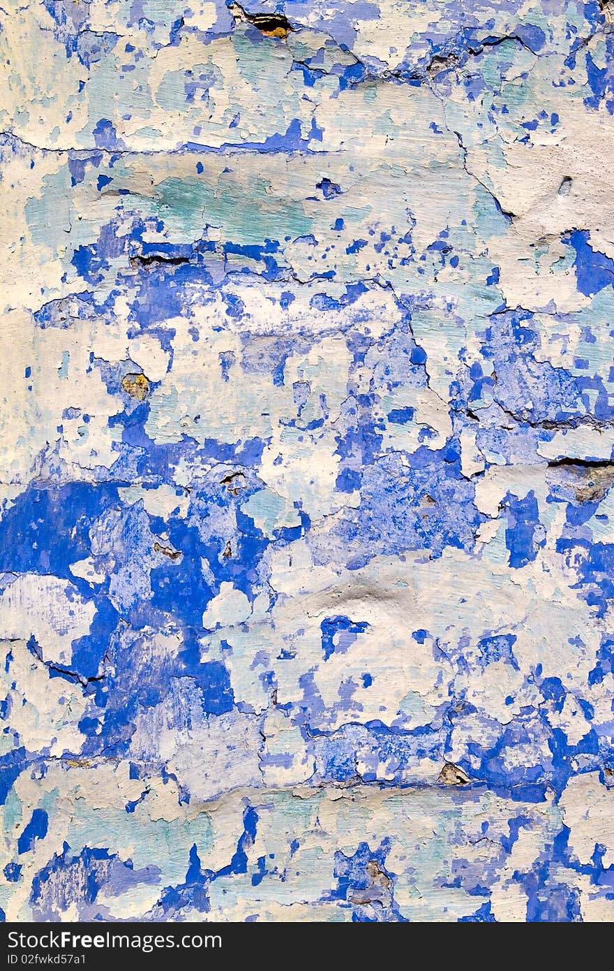 Texture - old dirty wall covered with peeling paint