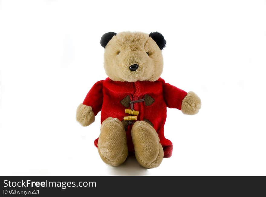 Teddy bear toy sitting on a white background