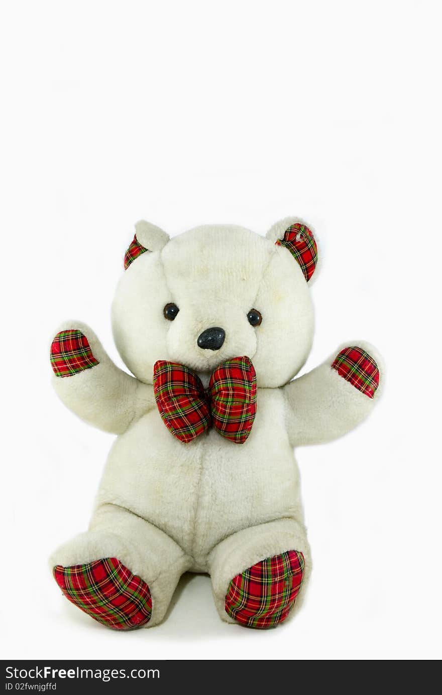 Teddy bear toy sitting on a white background