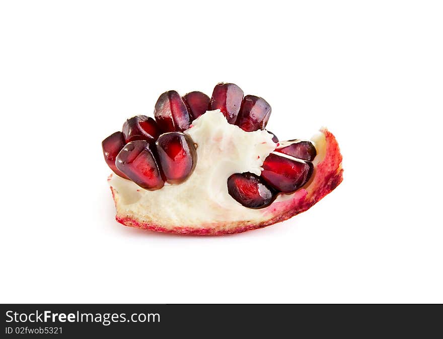 Macro of pomegranate berries isolated on the white background