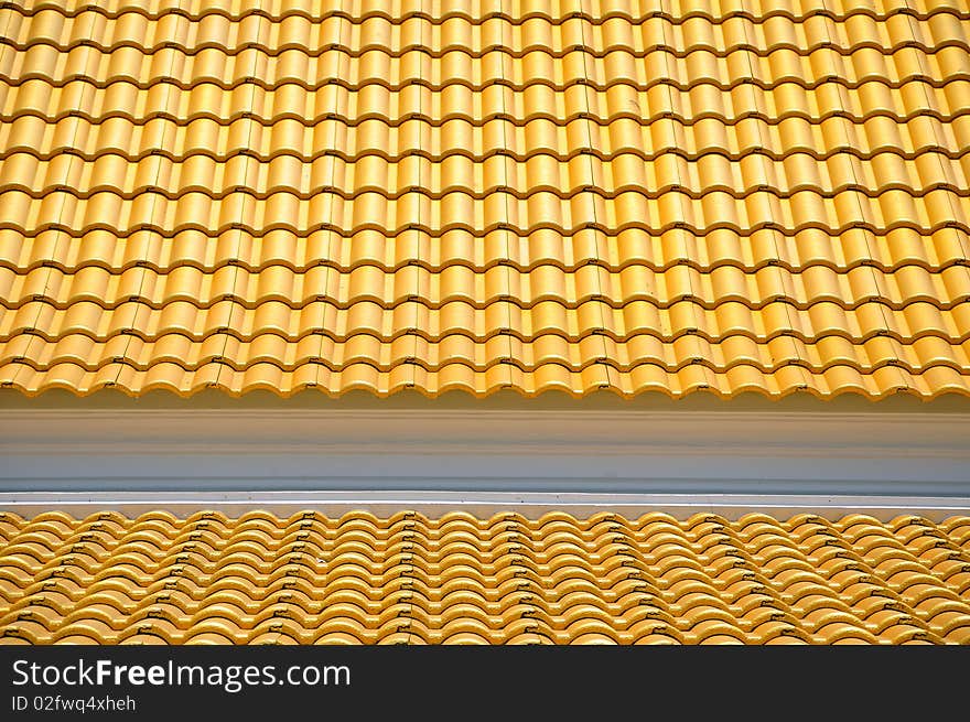 Golden tiles roof of thai temple. Golden tiles roof of thai temple.