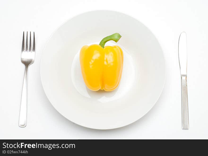 Paprika on the plate with a fork and knife