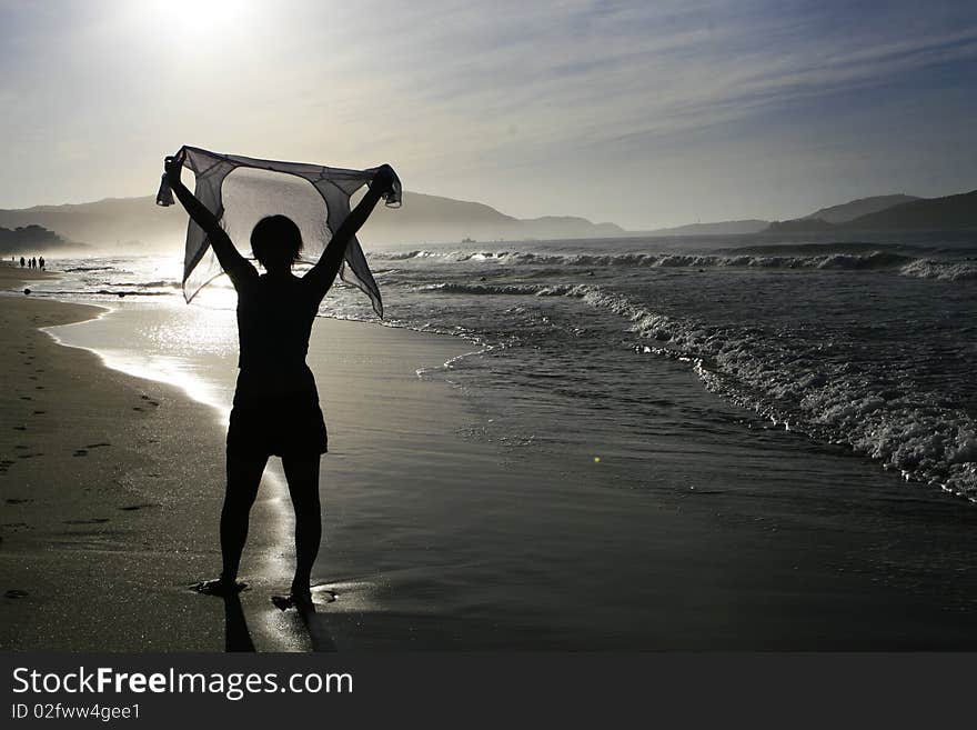 A woman silhouette, backlighting photography,at the beach of Yalong Bay in Sanya city of Hainan province in CHina