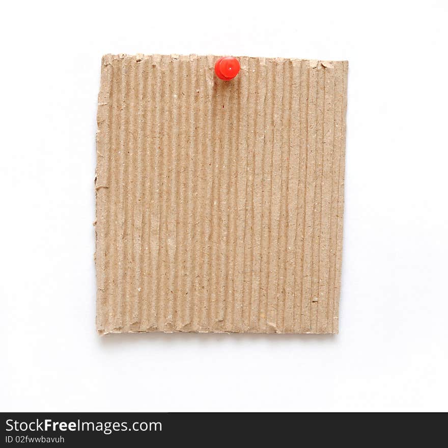 Cardboard on pin isolated on white background