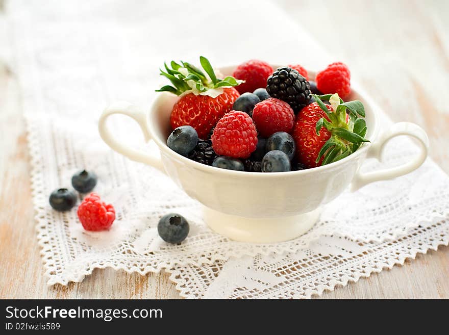 Mixed berries in a bowl : strawberries, raspberries, blueberries and blackberries. Mixed berries in a bowl : strawberries, raspberries, blueberries and blackberries.