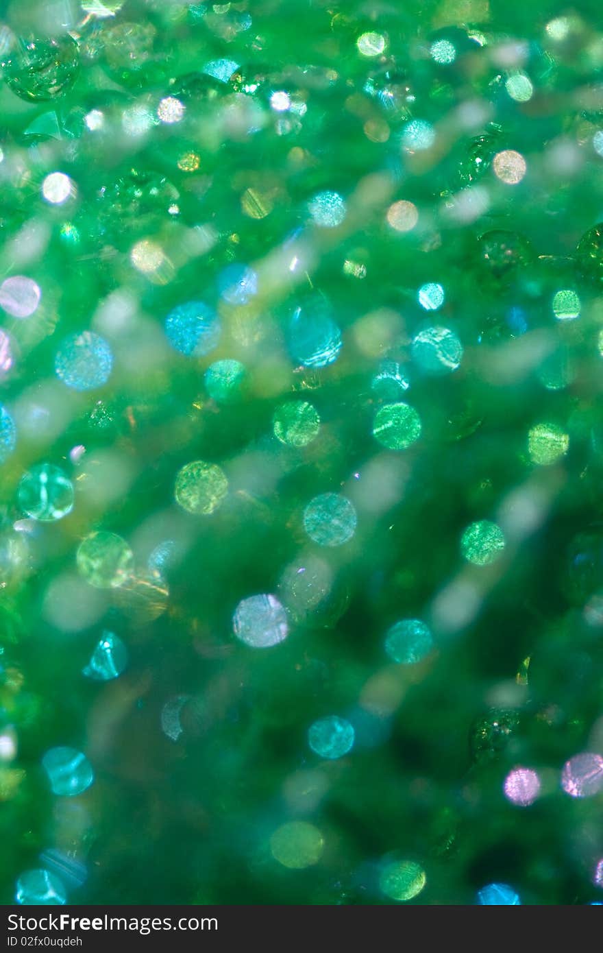 Beautiful abstract background from green beads with  a bokeh