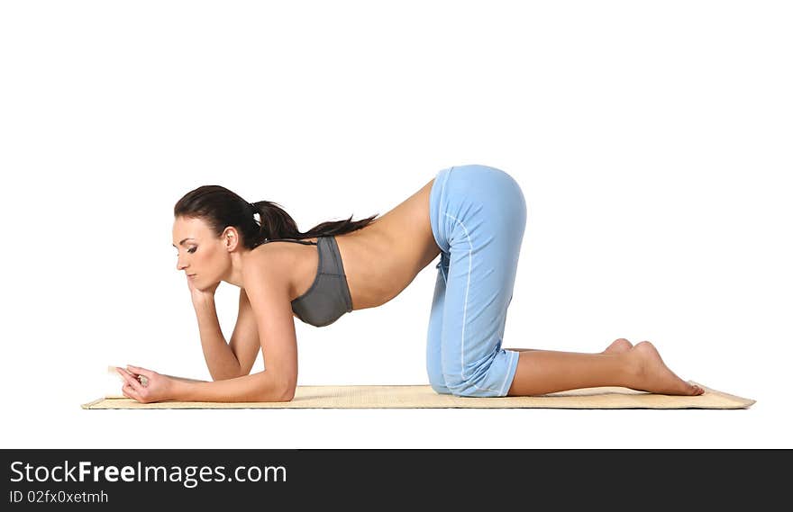 Young and attractive woman doing stretching exercise. Image isolated on a white background. Young and attractive woman doing stretching exercise. Image isolated on a white background.