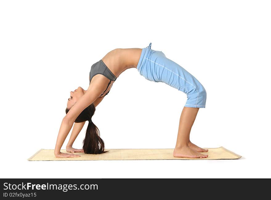 Young and attractive woman doing stretching exercise. Image isolated on a white background. Young and attractive woman doing stretching exercise. Image isolated on a white background.