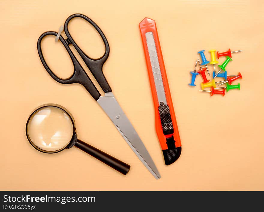 Office objects over brown paper background