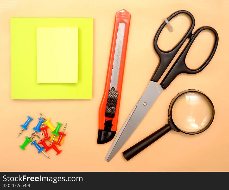 Office objects over brown paper background