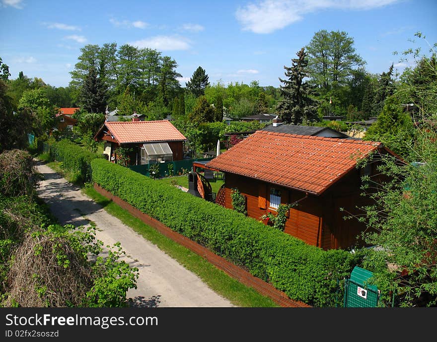 Allot garden with summerhouses in the nature in summer