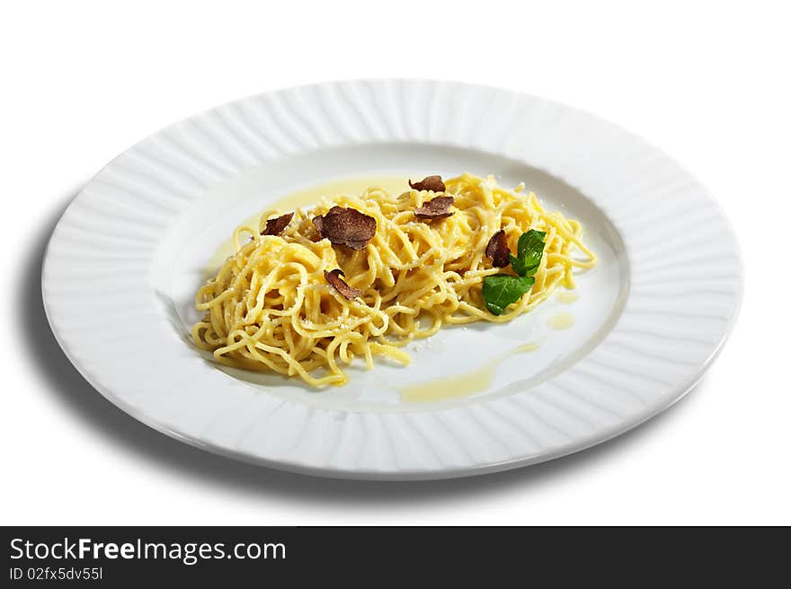 Home made Pasta with Parmesan Cheese and Tartufo Bianco (white truffle). Served with Basil Leaf