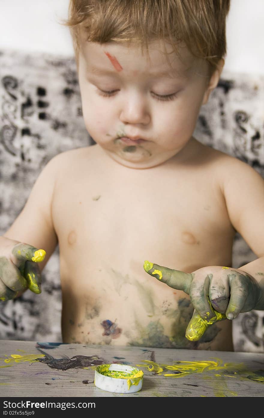 Dirty little boy sketching finger. Dirty little boy sketching finger.