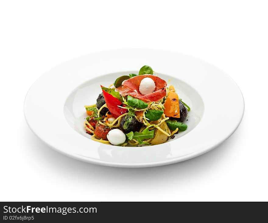 Spaghetti with Vegetables, Ham, Black Olives, Rucola and Pesto Sauce