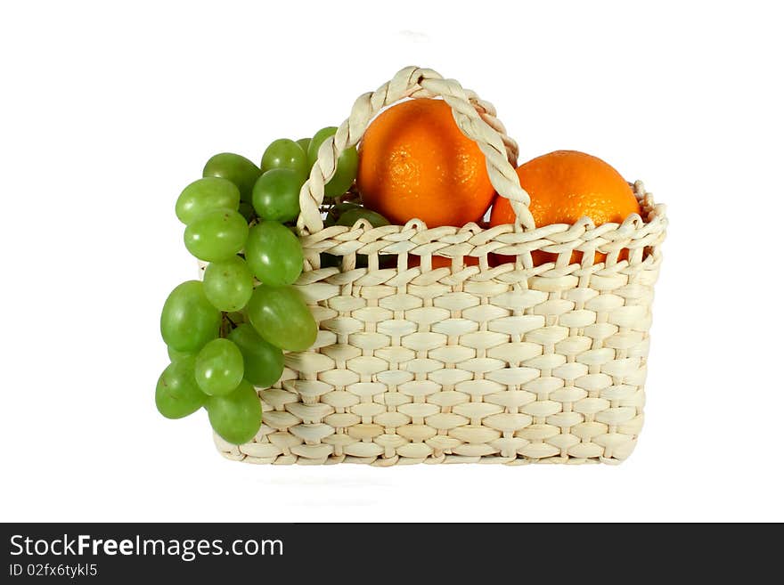 Basket full of grapes and oranges