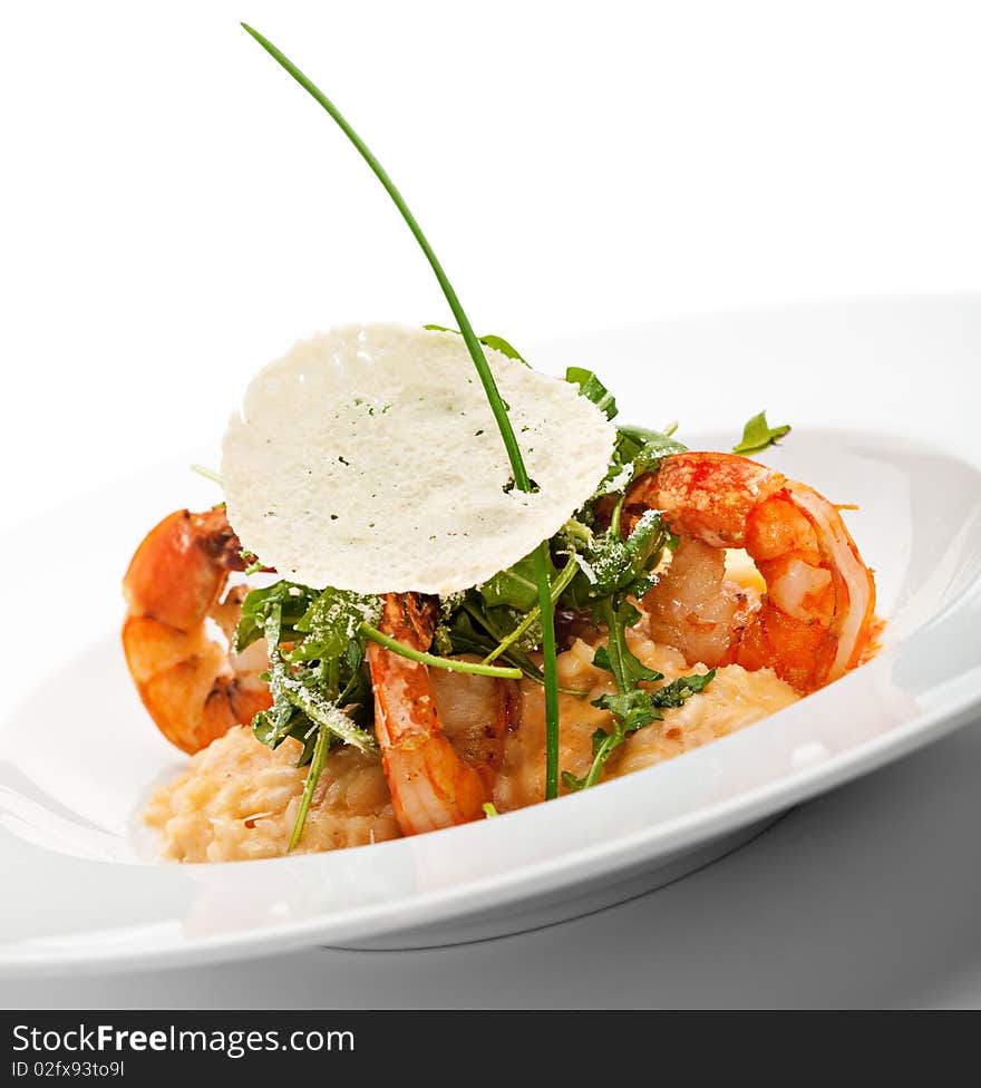 Risotto with Tiger Prawns and Rucola. Served with Parmesan Chip. Risotto with Tiger Prawns and Rucola. Served with Parmesan Chip