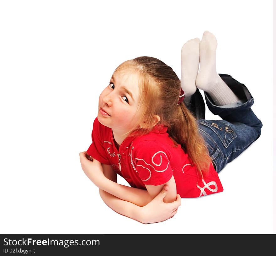 Little girl lies on floor isolated over white