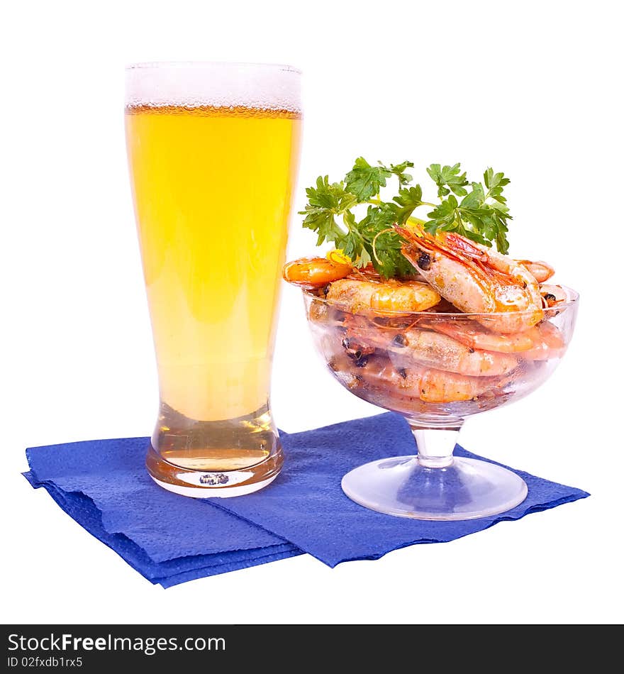 Beer in glass and dish with shrimps on white background. Beer in glass and dish with shrimps on white background