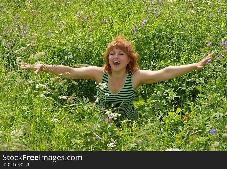 Beauty  Woman Sits On Meadow