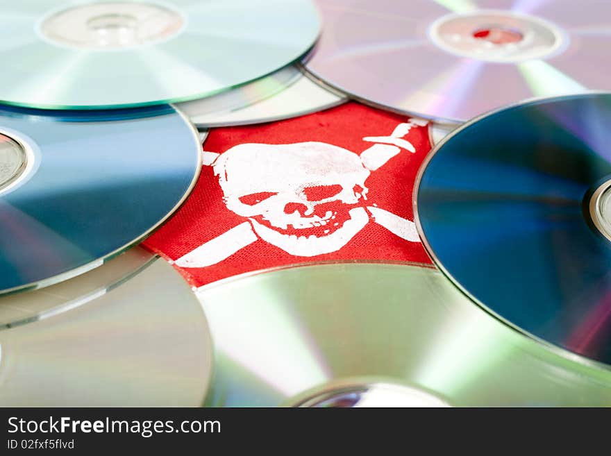 Dvd disks with pirate skull, concept