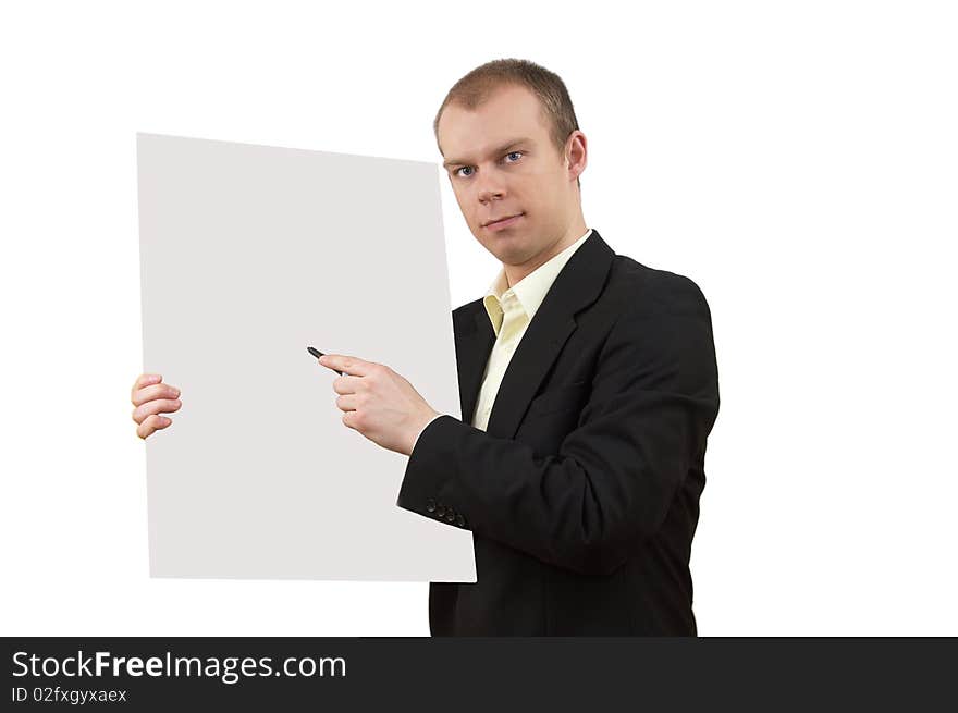 Young businessman in suit holding empty poster with clipping path, and showing on it, on white background. Young businessman in suit holding empty poster with clipping path, and showing on it, on white background