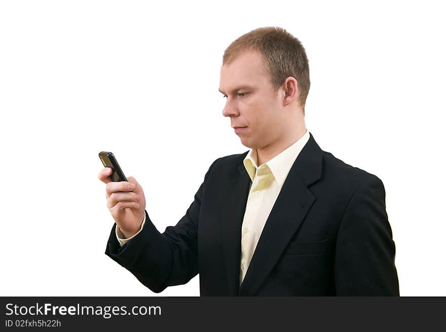 Young businessman in suit keeping cellphone, isolated on white